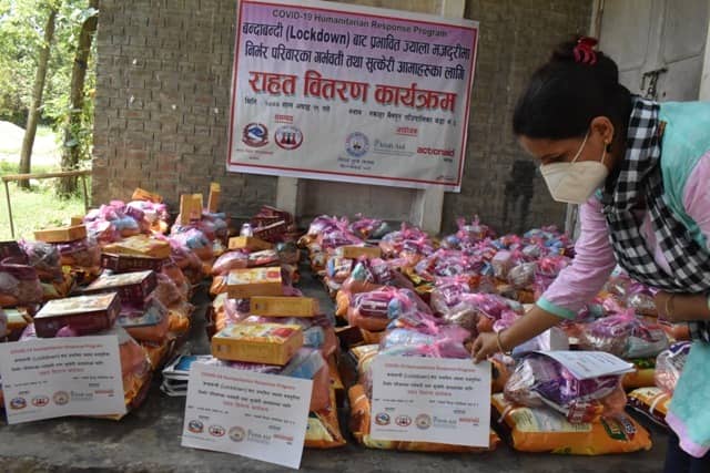 Kopila Chaulagain lives in Parsa District in Nepal, pictured organising aid packages for vulnerable women as part of ActionAid's covid-19 response worldwide