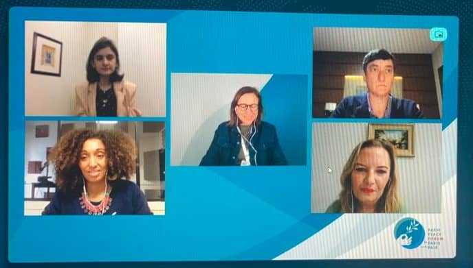 Virtual meeting with five diverse professionals on a conference call screen.