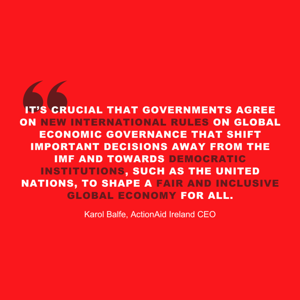 Quote on fair global economy by Karol Balfe, ActionAid Ireland CEO, on red background.