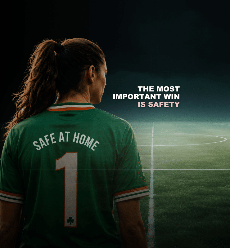 Soccer player in green jersey with Safe at Home text focuses on safety, with a field and motivational message in view.