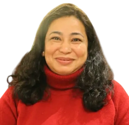 Smiling person in a red sweater sitting against a plain background.